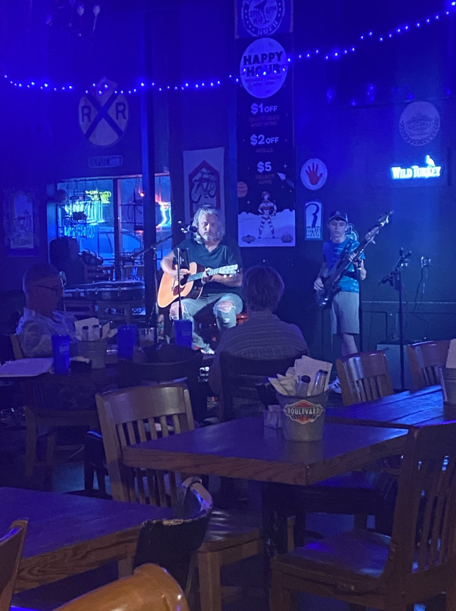 Local man singing his heart out during open mic night. Showing that anyone can do it.